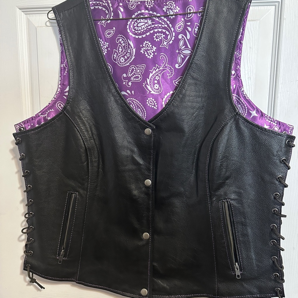 Leather vest with purple paisley liner